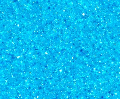 Leisure Pools fibreglass pool in Crystal Blue showing serene tropical-toned water.