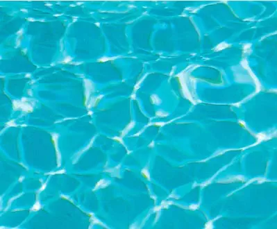 Leisure Pools fibreglass pool in Aquamarine showing bright turquoise water with a lively sparkle.