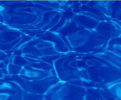 Leisure Pools fibreglass pool in Sapphire Blue showing deep blue water with a jewel-like sparkle.
